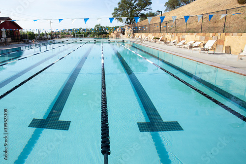 Swimming pool with lanes not being used. Nobody present because of health regulations due to pandemic 2020.