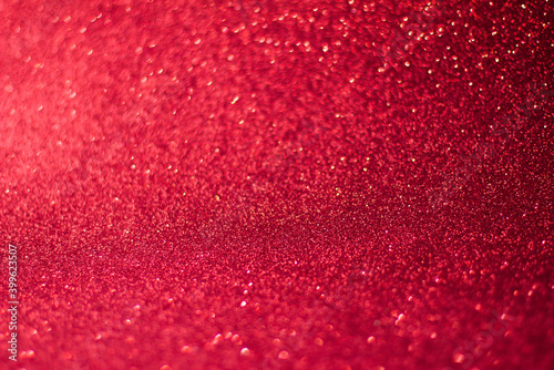 Red background with bokeh and glitter, valentine's day, Christmas and new year background soft focus