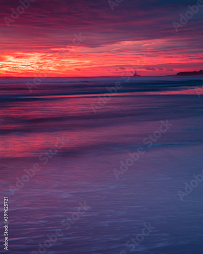 Colourful sunrise over Blyth Beach on the coast of Northunberland  England  UK. On a cold winter morning.