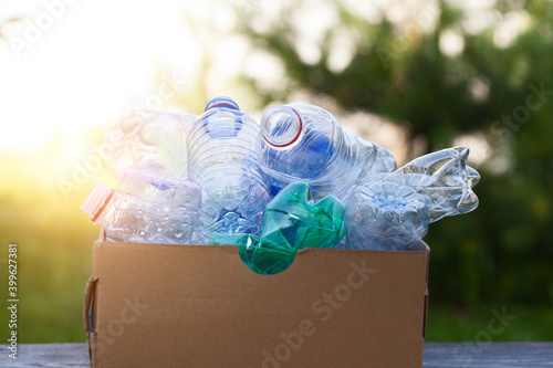waste bin cardboard box full of plastic bottles for recycling