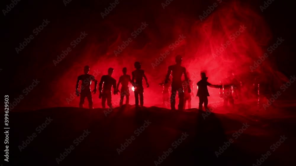 Scary view of zombies at cemetery dead tree, moon, church and spooky cloudy sky with fog, Horror Halloween concept. Selective focus Scary view of zombies at cemetery dead tree, moon, church and spooky cloudy sky with fog, Horror Halloween concept. Selective focus