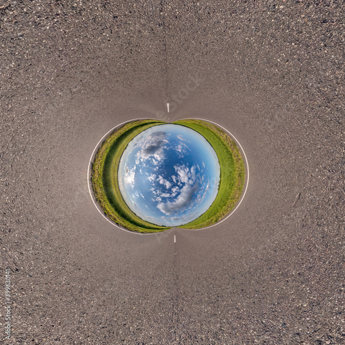 Blue little planet ball. Inversion of tiny planet transformation of spherical panorama 360 degrees. Spherical abstract aerial view. Curvature of space.