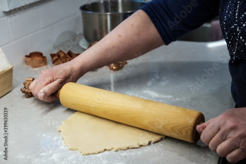 person rolling dough