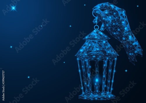 Christmas lantern in hand on the background of the starry sky. Polygonal construction of concatenated lines and points. Blue background.