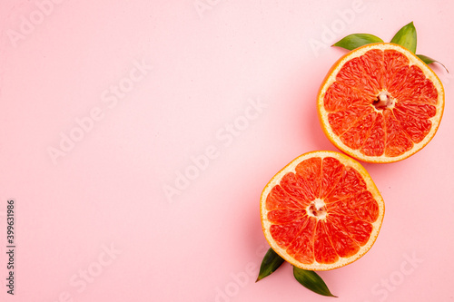 top view tasty grapefruits fruit slices on pink background mellow fresh fruit juice color diet citrus
