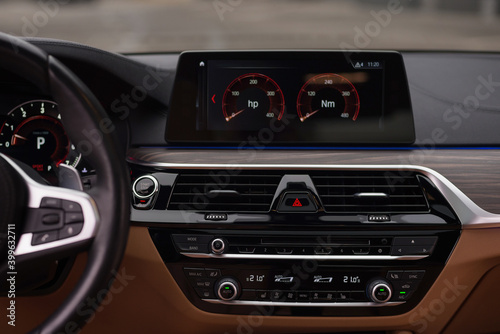 Multimedia, climat control buttons. Interior car detail. © alexdemeshko