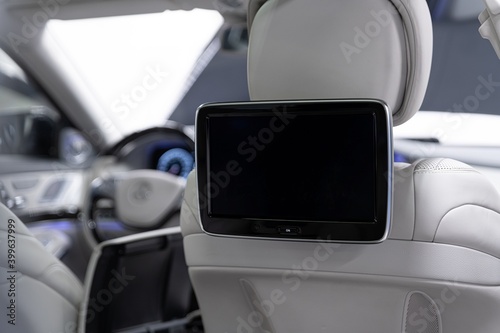 Modern luxury car interior with empty touchscreen monitor with copy space.