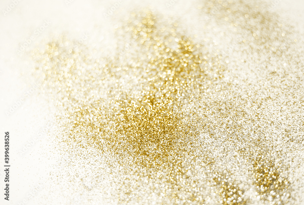Golden glitter shiny glowing background. Gold festive bokeh card for holidays.