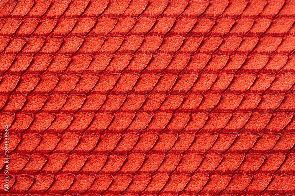Texture of genuine rough leather close-up, imitation of skin scaly exotic reptile, fashion red color, modern background Texture of genuine rough leather close-up, imitation of skin scaly exotic reptile, fashion red color, modern background