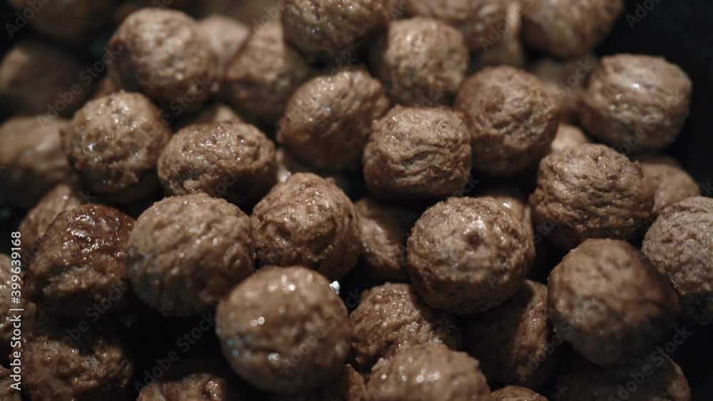 Juicy meat meatballs are fried in a frying pan. Juicy meat meatballs are fried in a frying pan.