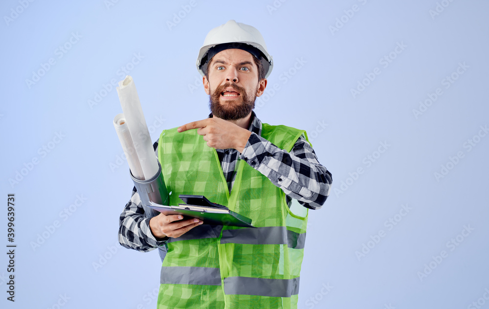 Builder in white helmets construction engineer blueprints work professional blue background