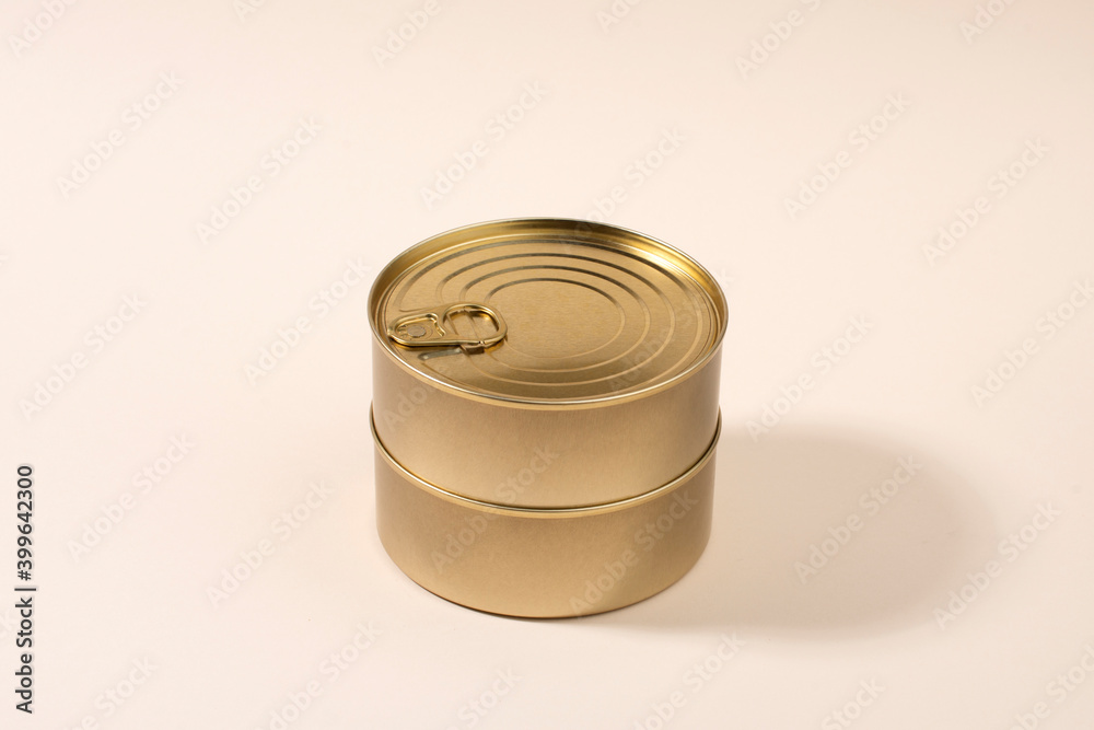 Gold unlabeled tin cans on light background Gold unlabeled tin cans on light background