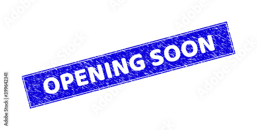 Grunge OPENING SOON rectangle stamp. OPENING SOON carved shape caption is located inside rectangle with border. Rectangular seal with grunge texture in blue color.