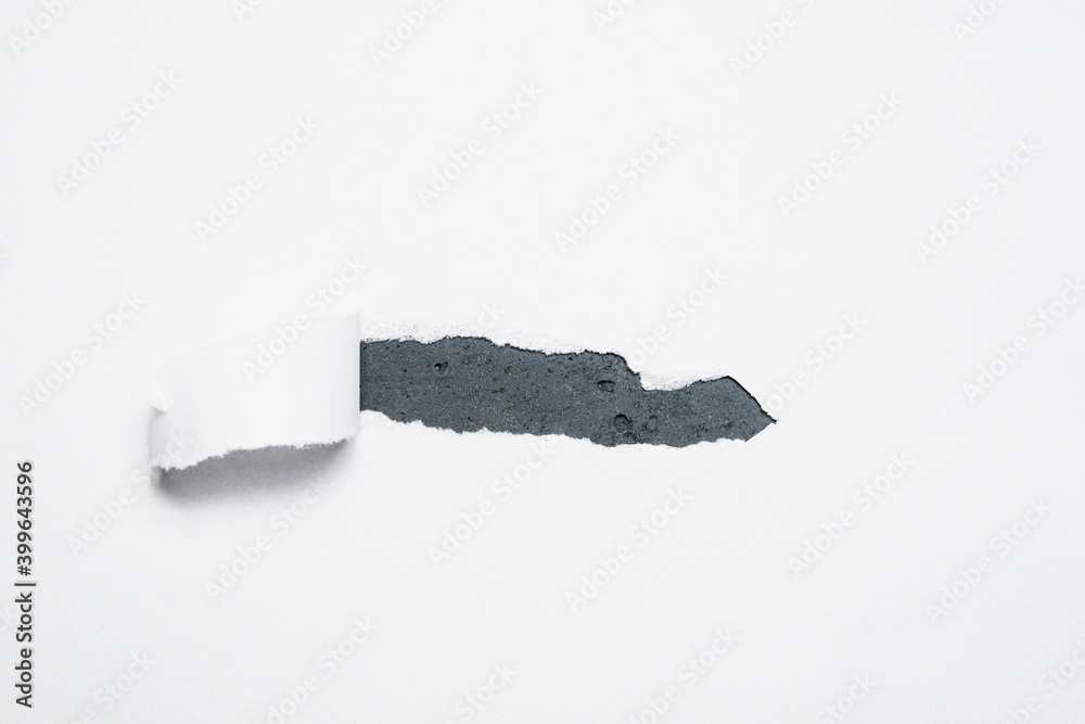 Obraz premium A piece of paper torn off revealing the contents. The concept of discovering content, supplementing with content.