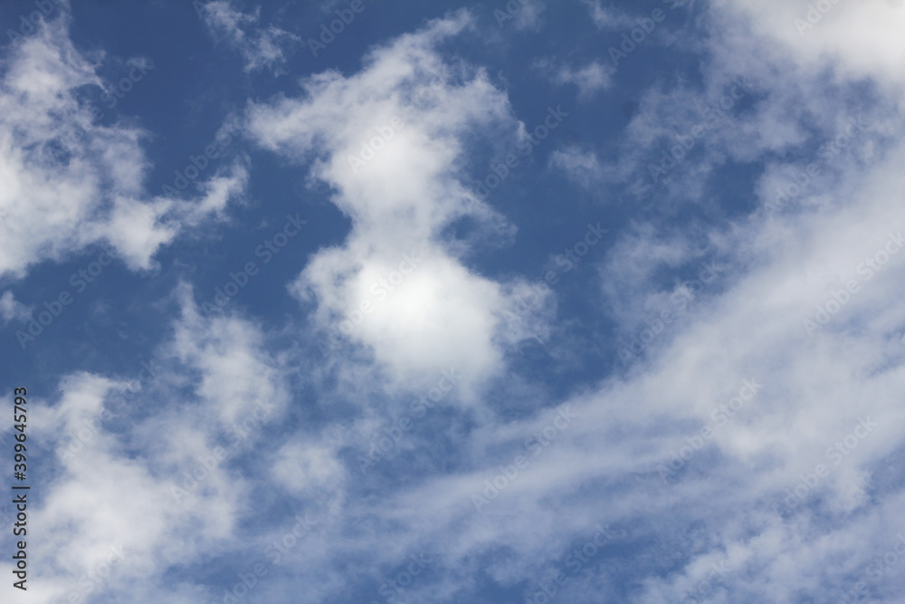 Blue sky with spaced white clouds Blue sky with spaced white clouds