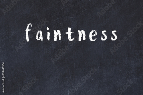 Black chalkboard with inscription faintness on in