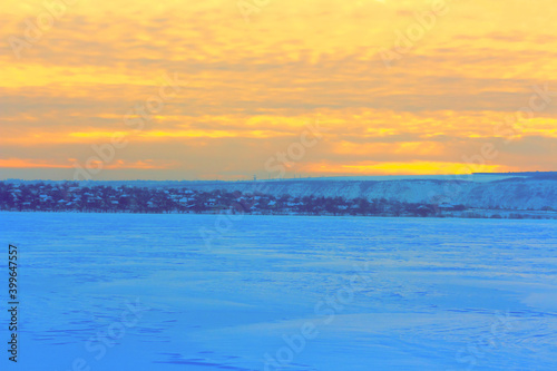 Orange sky over the frozen lake