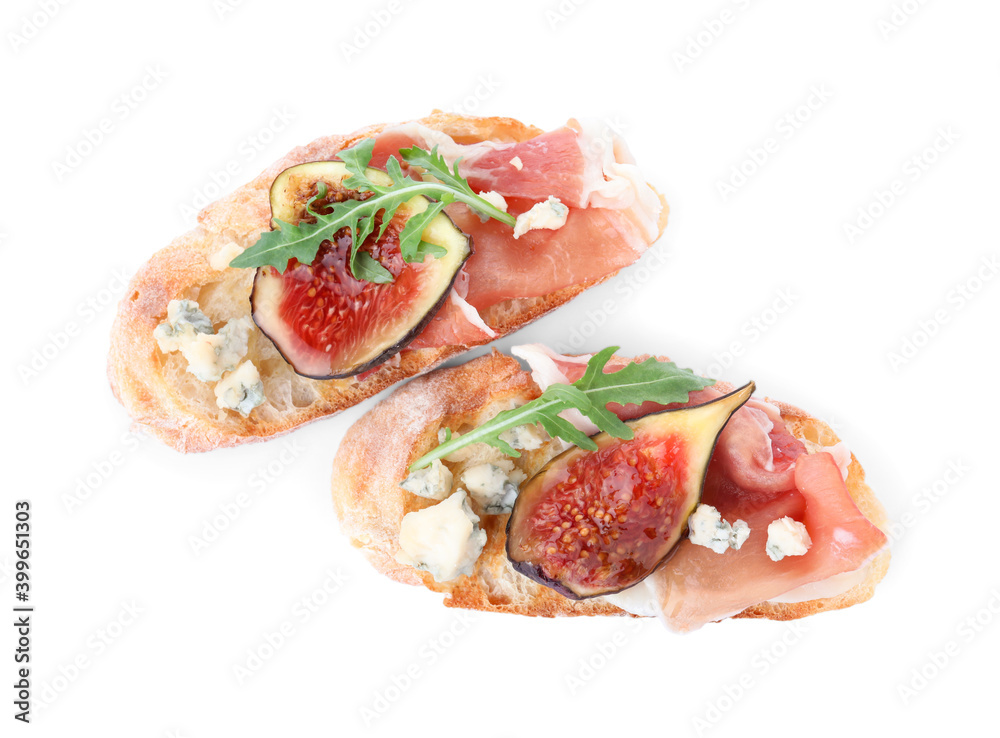 Sandwiches with ripe figs and prosciutto on white background, top view