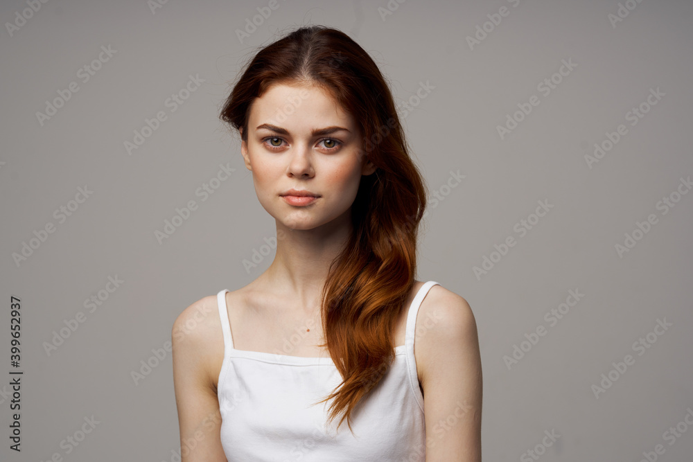 headache woman in white t-shirt touching face with hands health problems headache woman in white t-shirt touching face with hands health problems