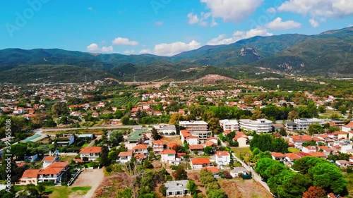 Wallpaper Mural Panorama of the Asprovalta with multiple buildings and greenery, green hills on the background. Aegean sea coast. Sunny day. Greece Torontodigital.ca