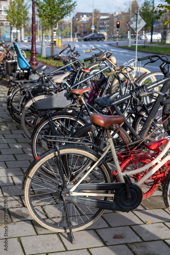 City life and transportation in Netherlands, bicycle parking in old part of Amsterdan © barmalini