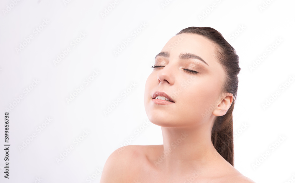 Beautiful Face of Young Woman with Clean Fresh Skin close up isolated on white. Beauty Portrait. Beautiful Spa Woman Smiling. Perfect Fresh Skin. Pure Beauty Model. Youth and Skin Care Concept Beautiful Face of Young Woman with Clean Fresh Skin close up isolated on white. Beauty Portrait. Beautiful Spa Woman Smiling. Perfect Fresh Skin. Pure Beauty Model. Youth and Skin Care Concept