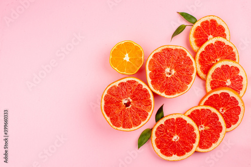 top view tasty grapefruits juicy fruit slices on pink background fresh mellow fruits color citrus juice diet