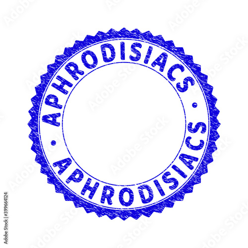 Grunge APHRODISIACS round rosette stamp seal. Copy space inside circle. Vector blue rubber imitation of APHRODISIACS caption inside round rosette. Stamp seal with corroded style.