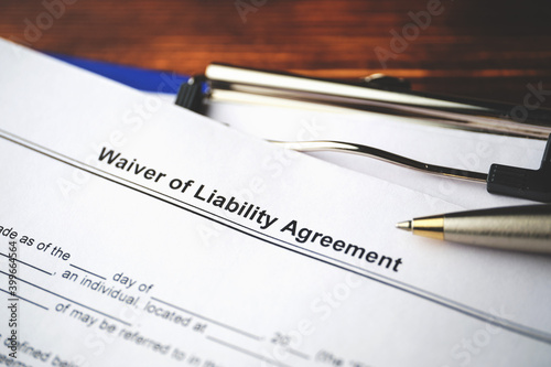Legal document Waiver of Liability Agreement on paper close up photo