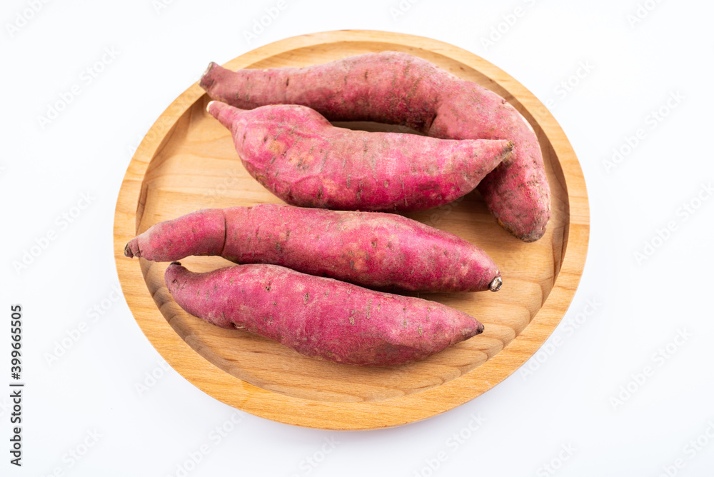 Fresh red sweet potatoes on white background Fresh red sweet potatoes on white background