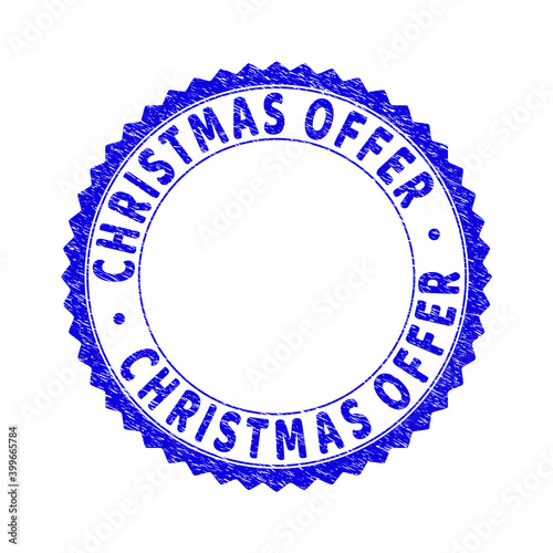 Grunge CHRISTMAS OFFER round rosette stamp seal. Copy space inside circle. Vector blue rubber overlay of CHRISTMAS OFFER caption inside round rosette. Stamp seal with dirty style.