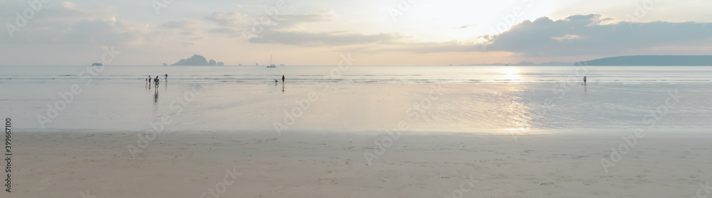 View of clean seashore with white sand and beautiful sky at sunset time. View of clean seashore with white sand and beautiful sky at sunset time.