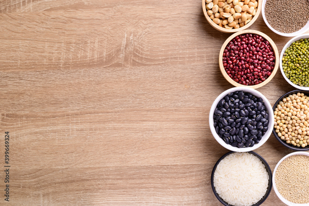 Various cereal grain in a bowl on wooden background (quinoa seeds, black kidney bean, peanut, perilla seeds, soybean, azuki beans, rice grain and mung beans) Various cereal grain in a bowl on wooden background (quinoa seeds, black kidney bean, peanut, perilla seeds, soybean, azuki beans, rice grain and mung beans)