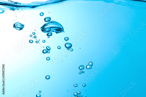 Pouring made a splash of blue waves under the water and Bubbles flowing up on water surface in nature. with copy space