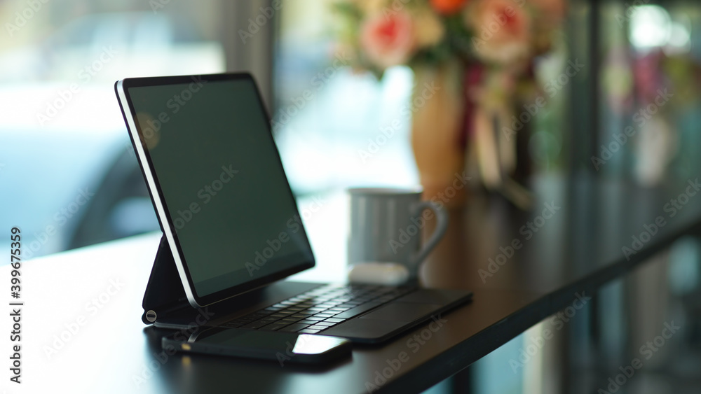 Portable workspace with digital tablet and smartphone on black desk Portable workspace with digital tablet and smartphone on black desk