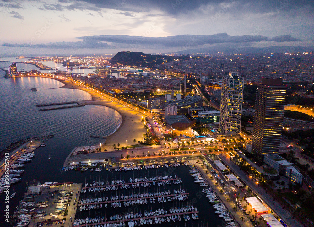 Aerial view of Mediterranean coast in Barcelona in night lights