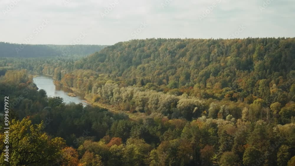 Amazing look to the Gauja river valley on the mountain top and autumn colorful woods