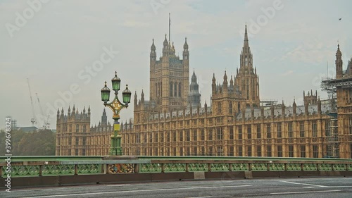 London in Coronavirus Covid-19 lockdown with empty roads and streets with no cars or traffic and no people at Westminster Bridge with Houses of Parliament in England, UK at rush hour