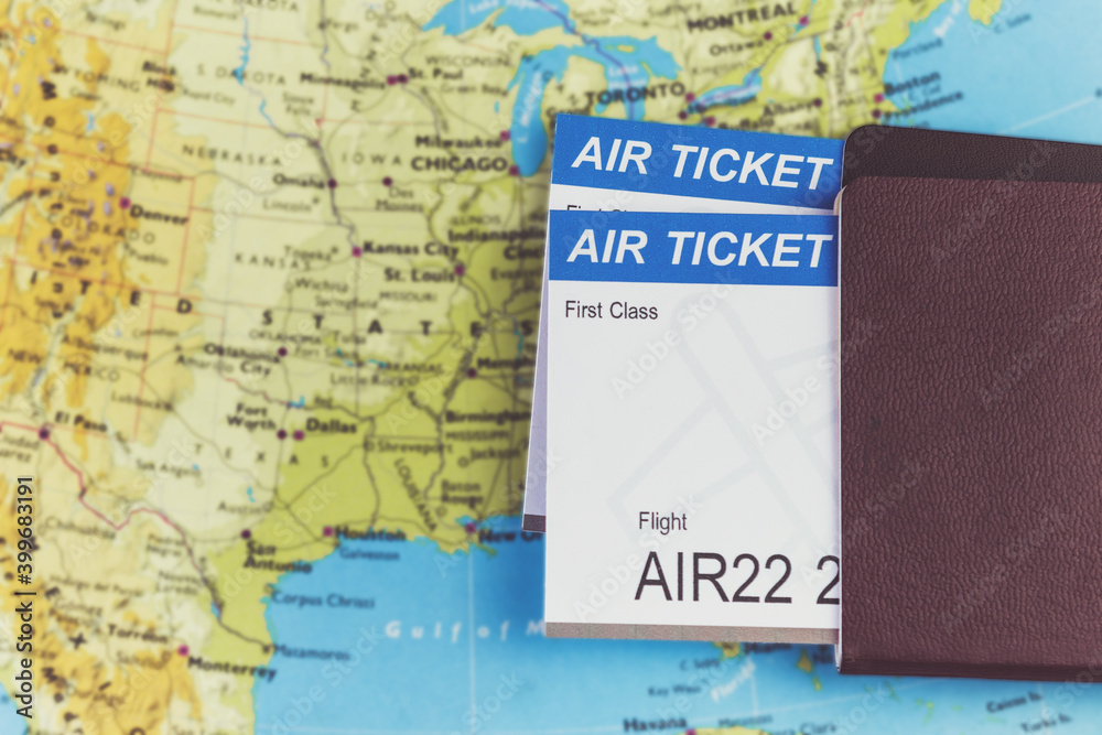Air Ticket and passports on the map, flight to america, travel concept