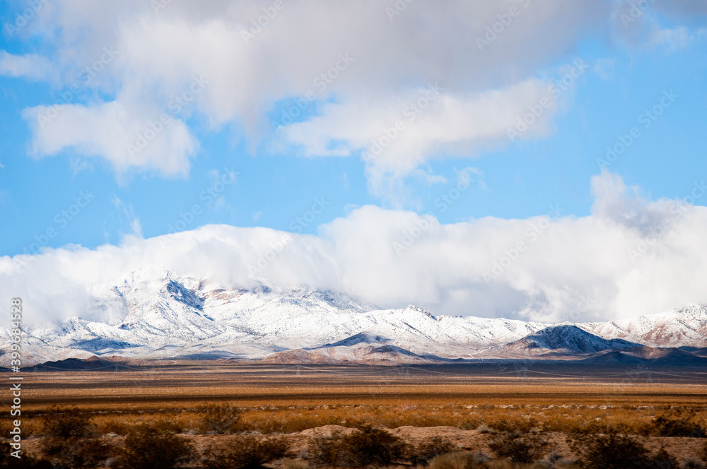 Fototapeta premium Snow capped mountains in the Mojave desert