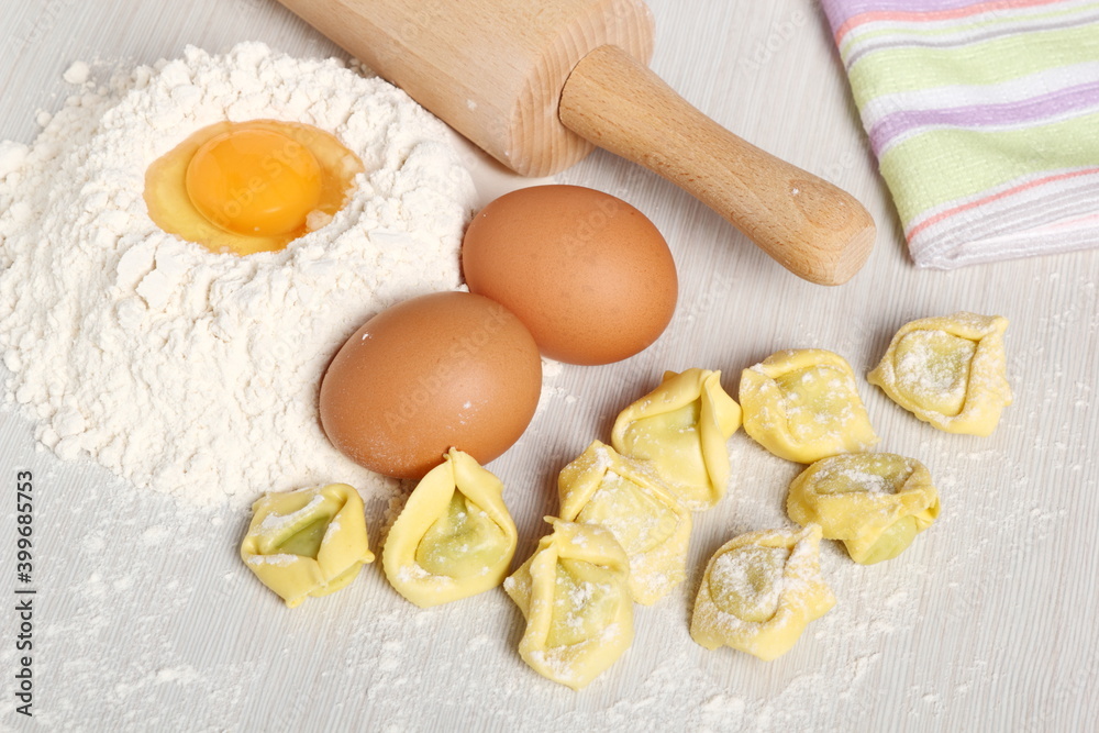 Making tortellini stuffed with spinach and ricotta Making tortellini stuffed with spinach and ricotta