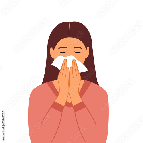 Sneezing woman on white background. A woman in pink dress sneezing in handkerchief. Sick woman sneeze. Season allergy. Covid19 coronavirus outbreak.