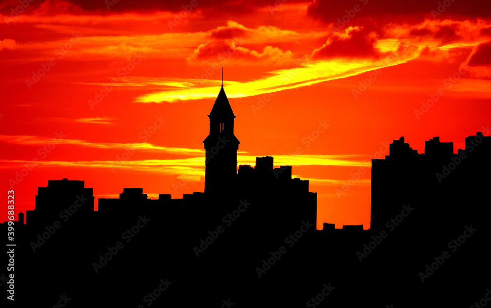 Red sunset city night  skyline at sunset Silhouettes of buildings at dusk.