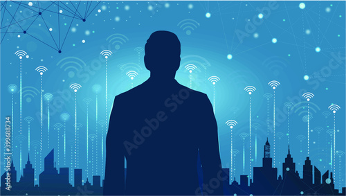 The silhouette of a businessman looking out of the city silhouette and tall buildings With the notation of a social media network signal at night