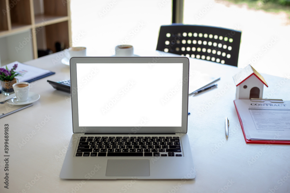 Laptop computer with blank screen on table in office. Mock up. Laptop computer with blank screen on table in office. Mock up.