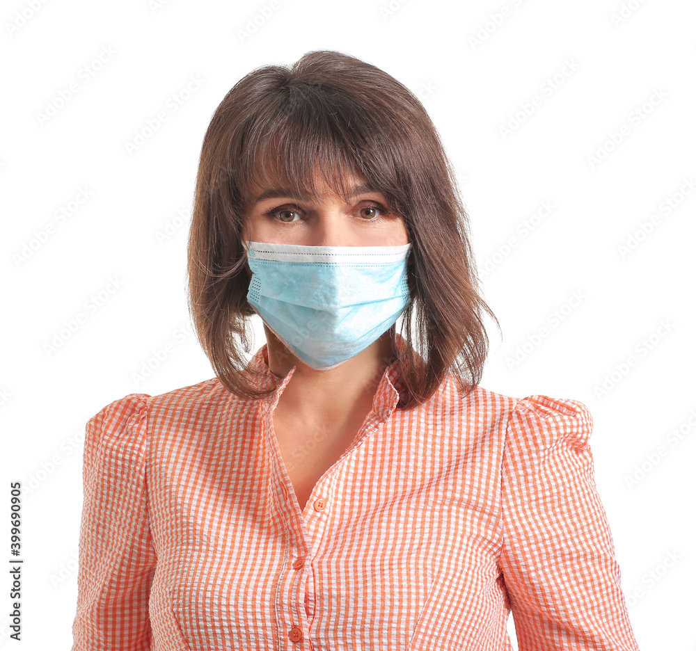 Beautiful mature woman wearing medical mask on white background. Concept of coronavirus epidemic Beautiful mature woman wearing medical mask on white background. Concept of coronavirus epidemic