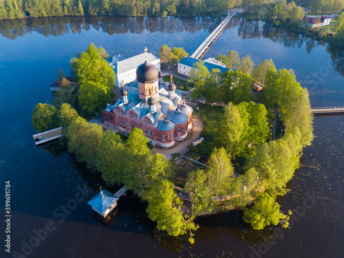 Scenic landscape with Holy Vvedensky Island Monastery located on island in middle of Vvedensky lake near Pokrov, Russia photo