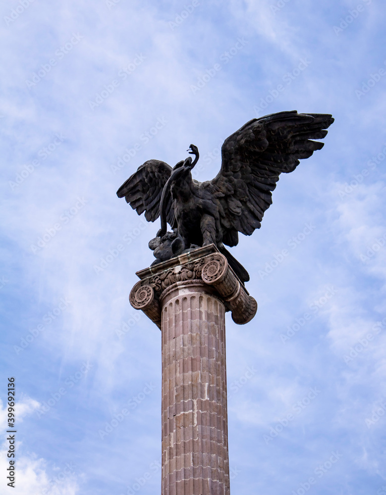 Sculpture in stone of the republican eagle, in the Exedra of the Plaza patria de Aguascalientes. April, 2018. Aguascalientes, México