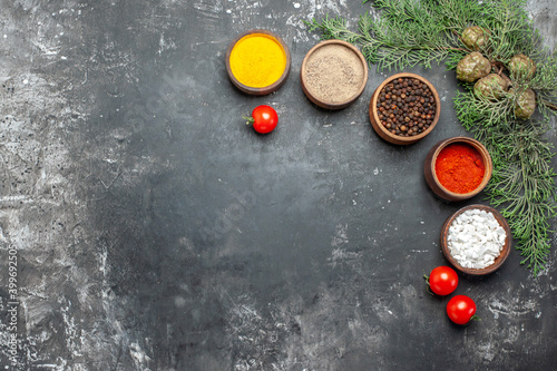 top view different seasonings with tomatoes on grey background color pepper photo food