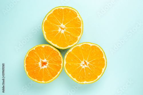 top view fresh tangerine slices on blue background photo color fruit orange citrus
